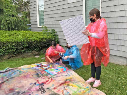 kids engaging in a spray paint activity