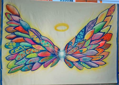 loose canvas artwork portraying large wings