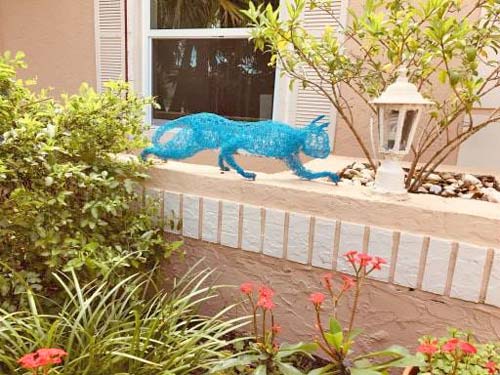 cat sculpture in garden