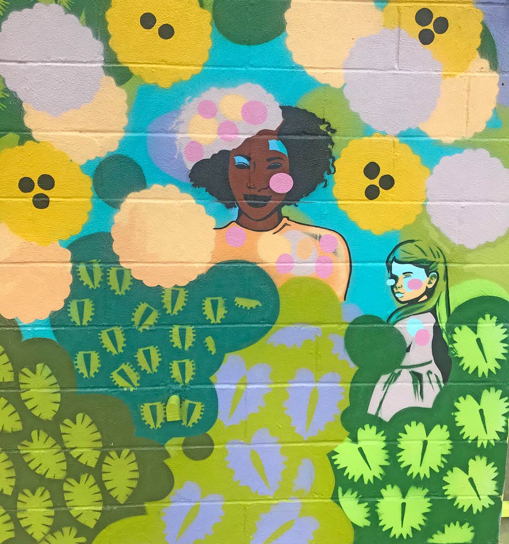 Colorful wall featuring female faces