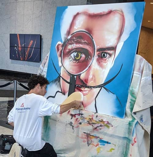 man painting portrait of Salvador Dali