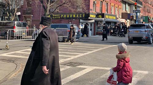 Hasidic Jews walking on street