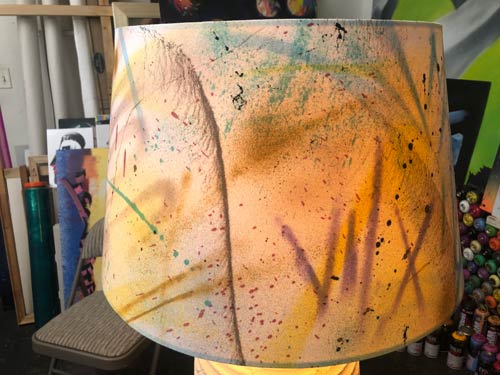 lamp shade with graffiti painted onto it